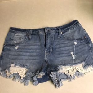 Light blue, ripped jean shorts. High-rise. Size 6